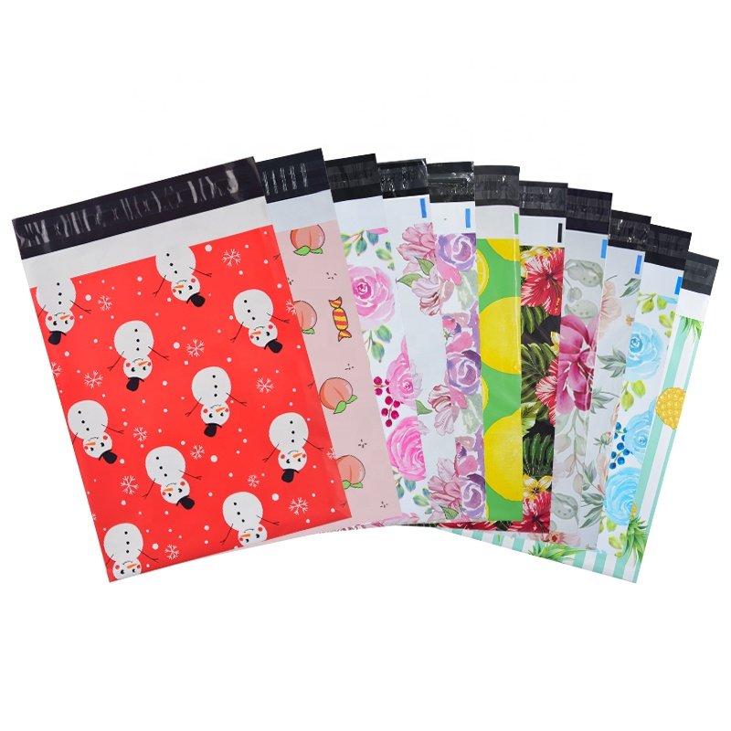 Custom printed poly mailers in floral, fruit and seasonal designs, fanned out to show the self-seal strip